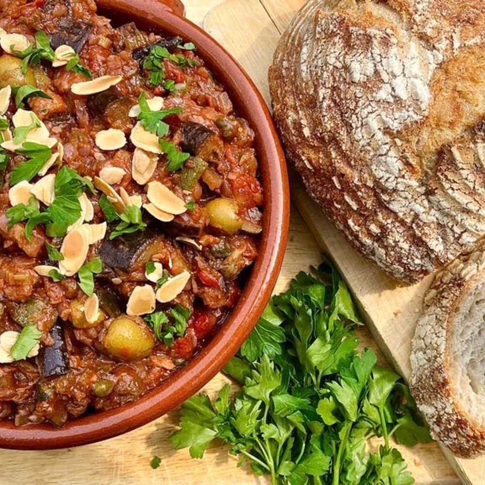 Frozen: Sicilian aubergine and courgette caponata with olives and capers. Vegan. Serves two (500 ml)