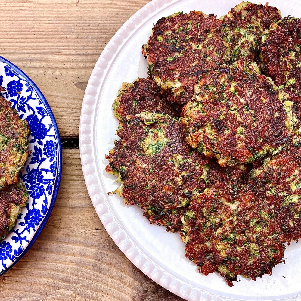 Frozen: Courgette, halloumi and dill fritters with slow-cooked tomato sauce. Veg. Serves two