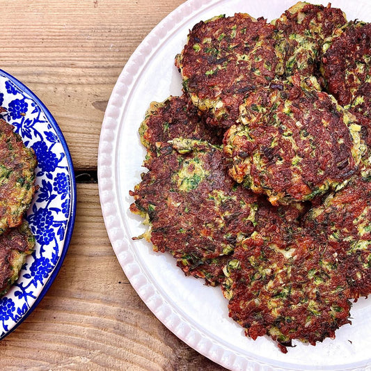 Frozen: Courgette, halloumi and dill fritters with slow-cooked tomato sauce. Veg. Serves two